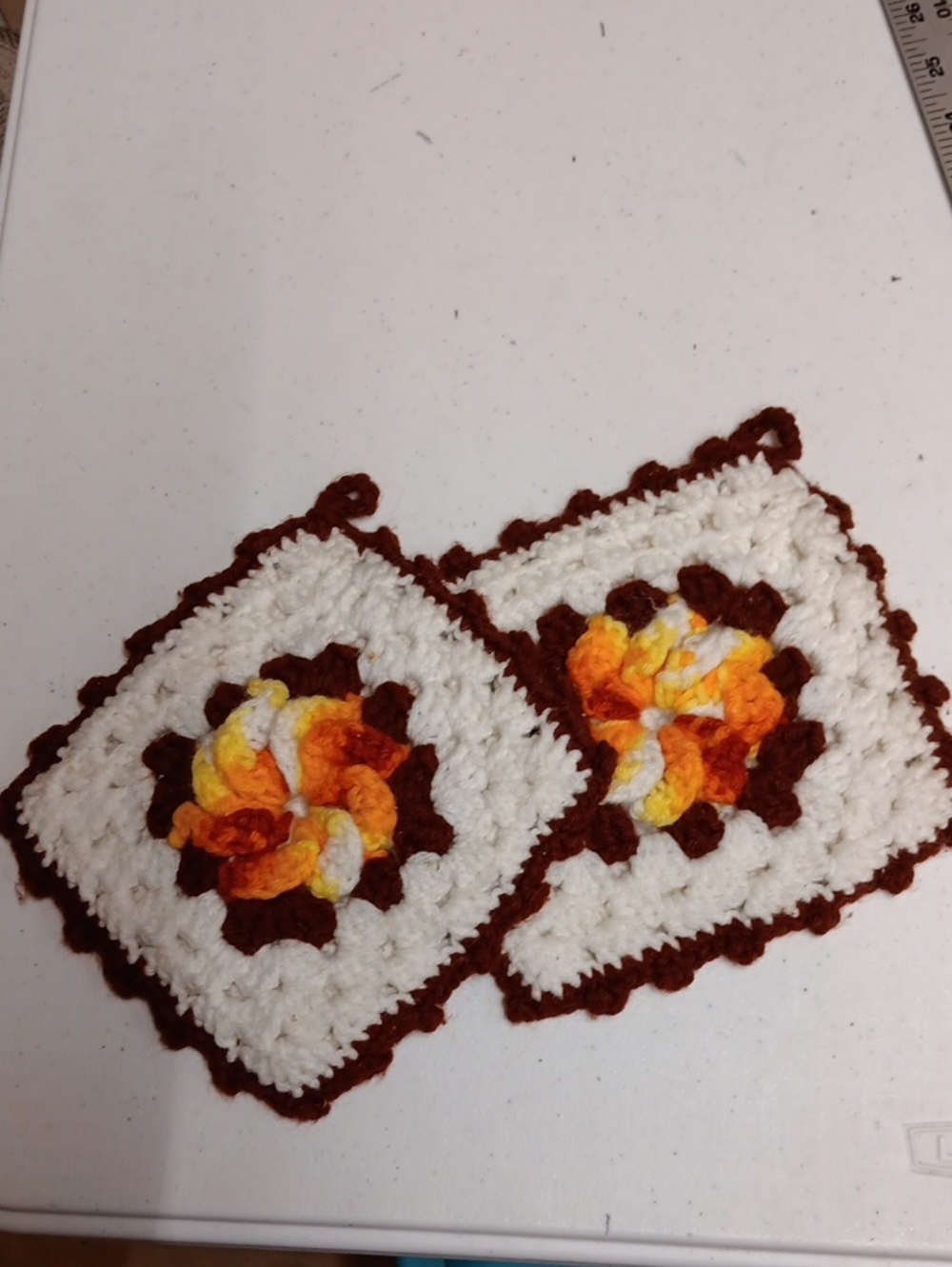 Handmade White and Brown Crochet Pot Holders with Yellow-Orange Floral Center